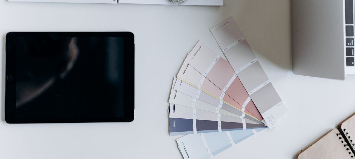 Design desk with a tablet and color swatch fans