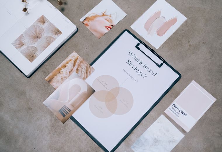 Brand identity moodboard with color swatches and print samples